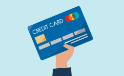 Uma mão segurando um modelo genérico de cartão de crédito